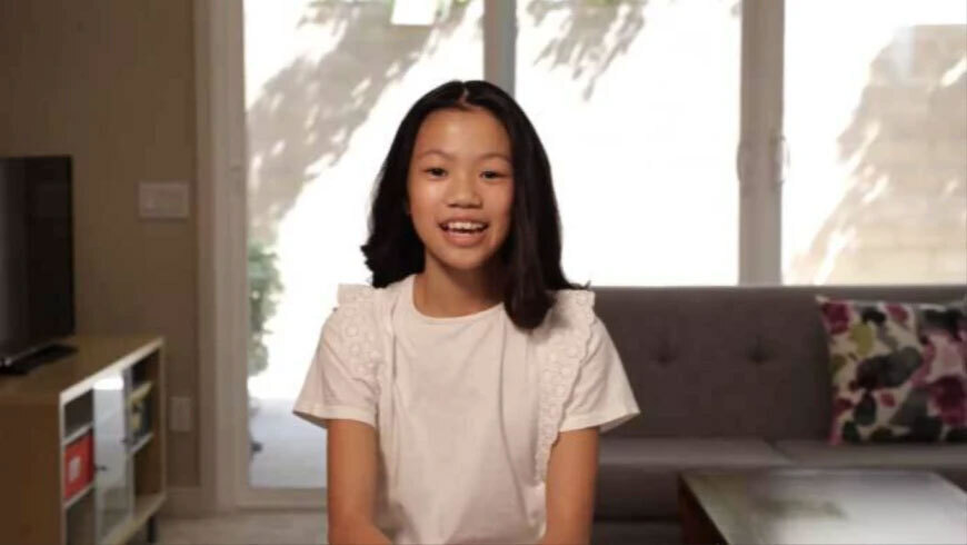 Photograph of a girl smiling.