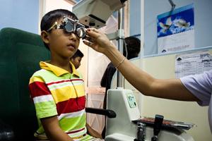 A young boy at an eye exam appointment.