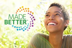 picture of smiling woman outside with CooperVision Made Better logo next to her