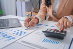 picture of bookkeeper planning financial strategy and crunching numbers