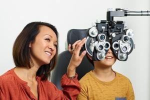 kid and parent during eye exam