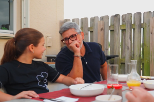 Picture of father and daughter outside smiling and talking
