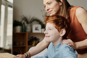 Mother and son looking at a computer screen