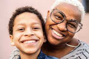 mom and boy smiling