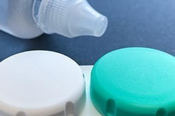 Travel sized contact lens case and solution.