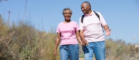 mature couple smiling on a walk