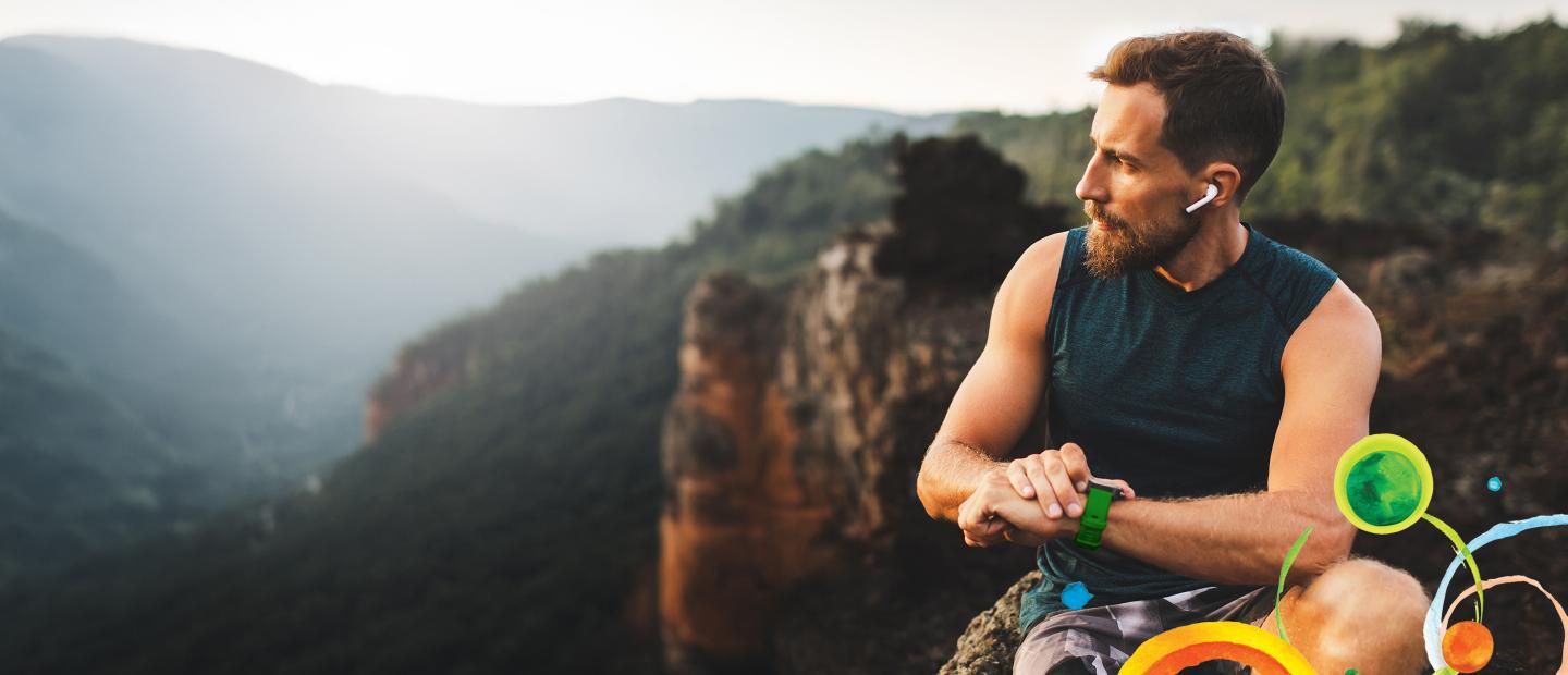 man on the top of a mountain, looking to his right side