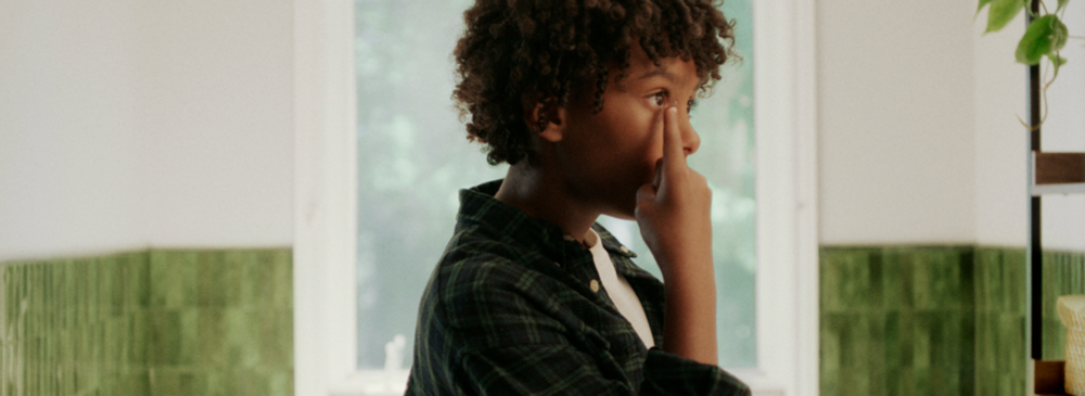 Child inserting contact lens