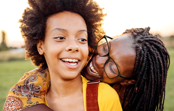 mom hugging child outdoor