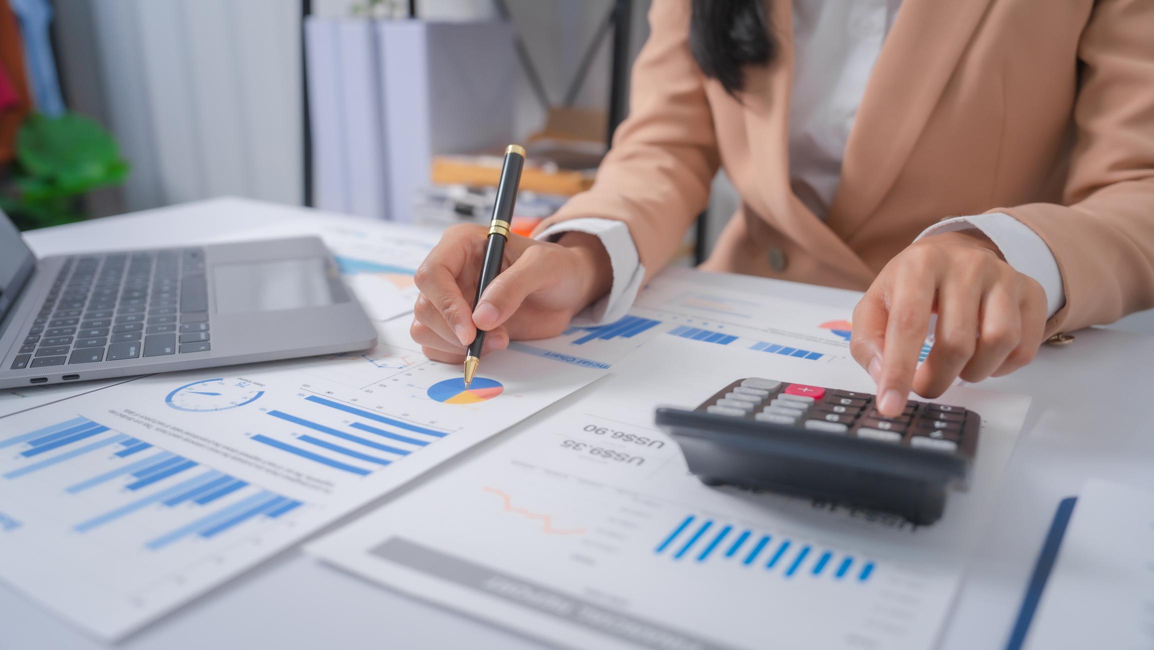 picture of bookkeeper planning financial strategy and crunching numbers