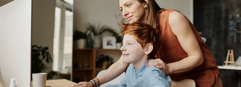 Mother and son looking at screen