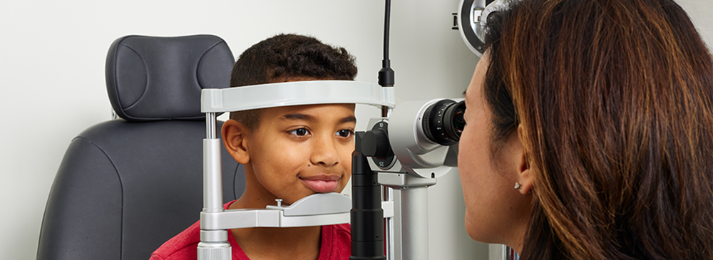 Optometrist performing eye exam
