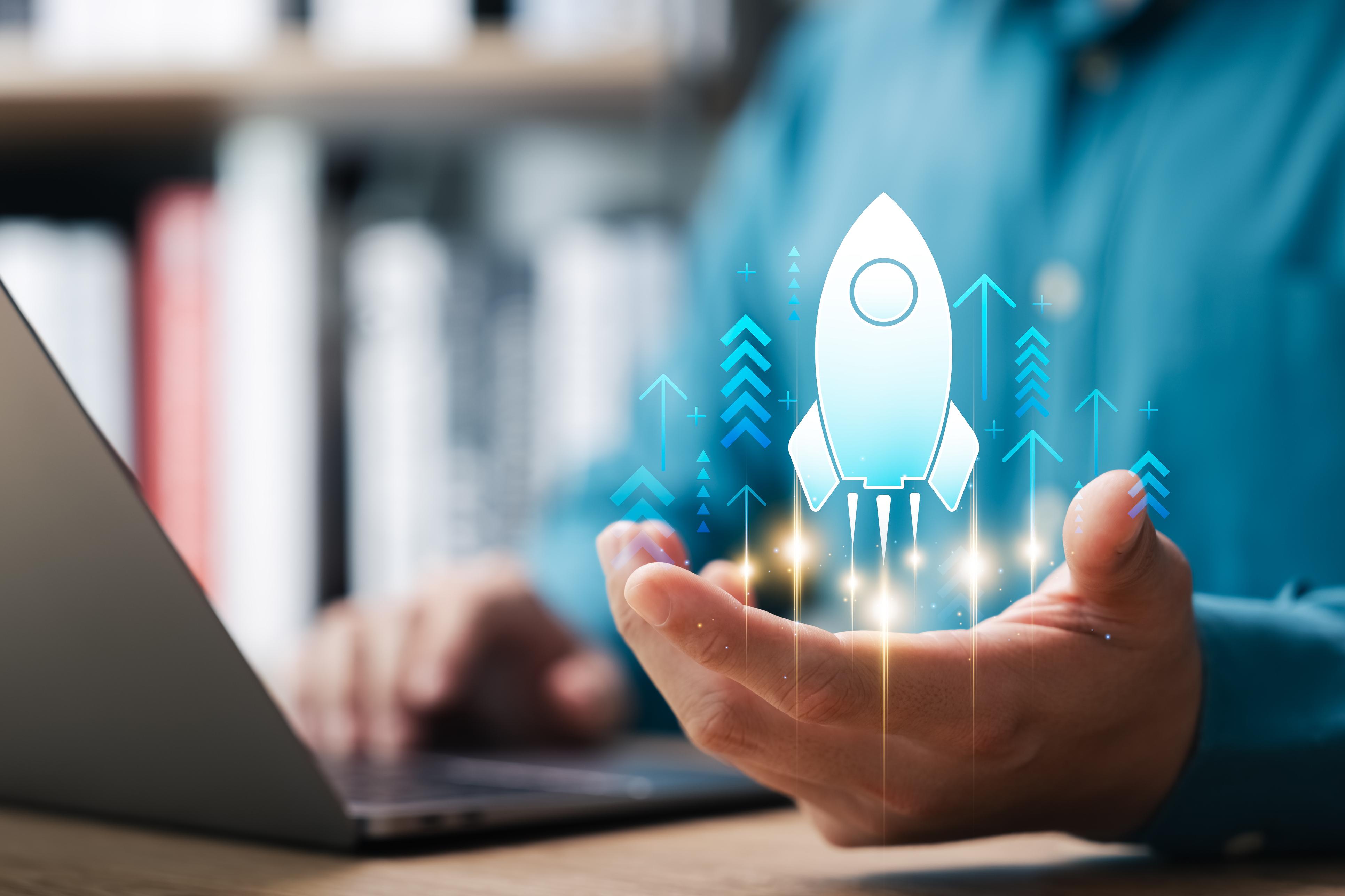 businessman touching virtual rocket indicating rapid business growth
