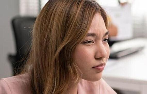 woman struggling to read