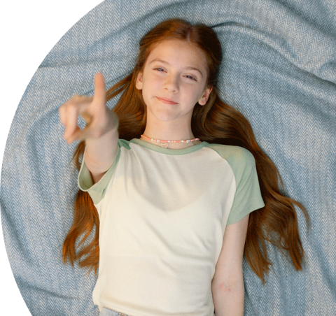 Young girl smiling confidently wearing MiSight 1 day contact lenses