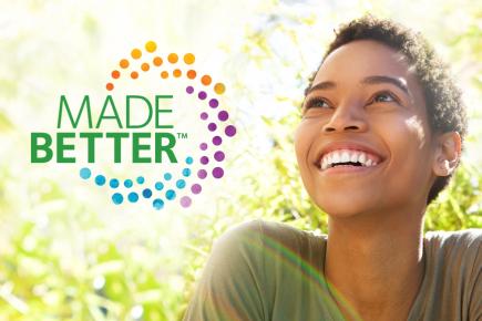 picture of smiling woman outside with CooperVision Made Better logo next to her