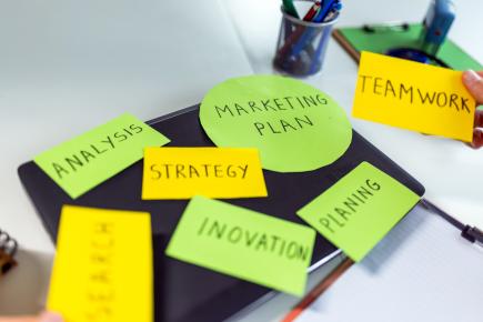 picture of sticky notes featuring marketing strategy ideas