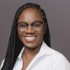 A photo of optometrist Essence Johnson, Executive Director of Black Eyecare Perspective and Director of Healthcare Careers at Uplift Education.