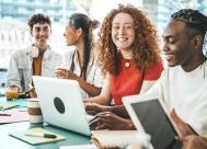 A group of college students on their computers