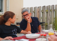 Picture of father and daughter outside smiling and talking