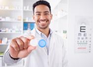 Eye doctor in an optometric practice holding a contact lens case.